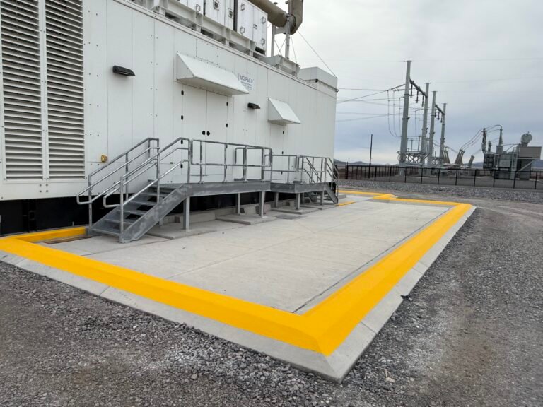 Bright yellow curb and perimeter marking on commercial asphalt