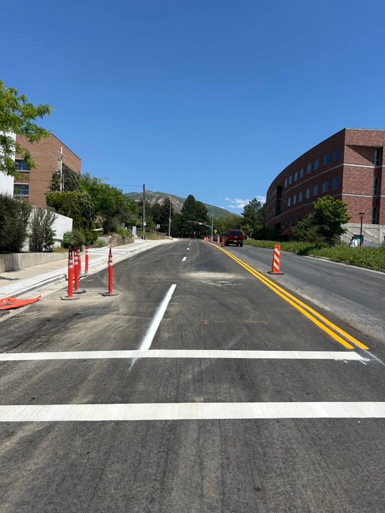 Crisp white roadway lane lines and stop markings